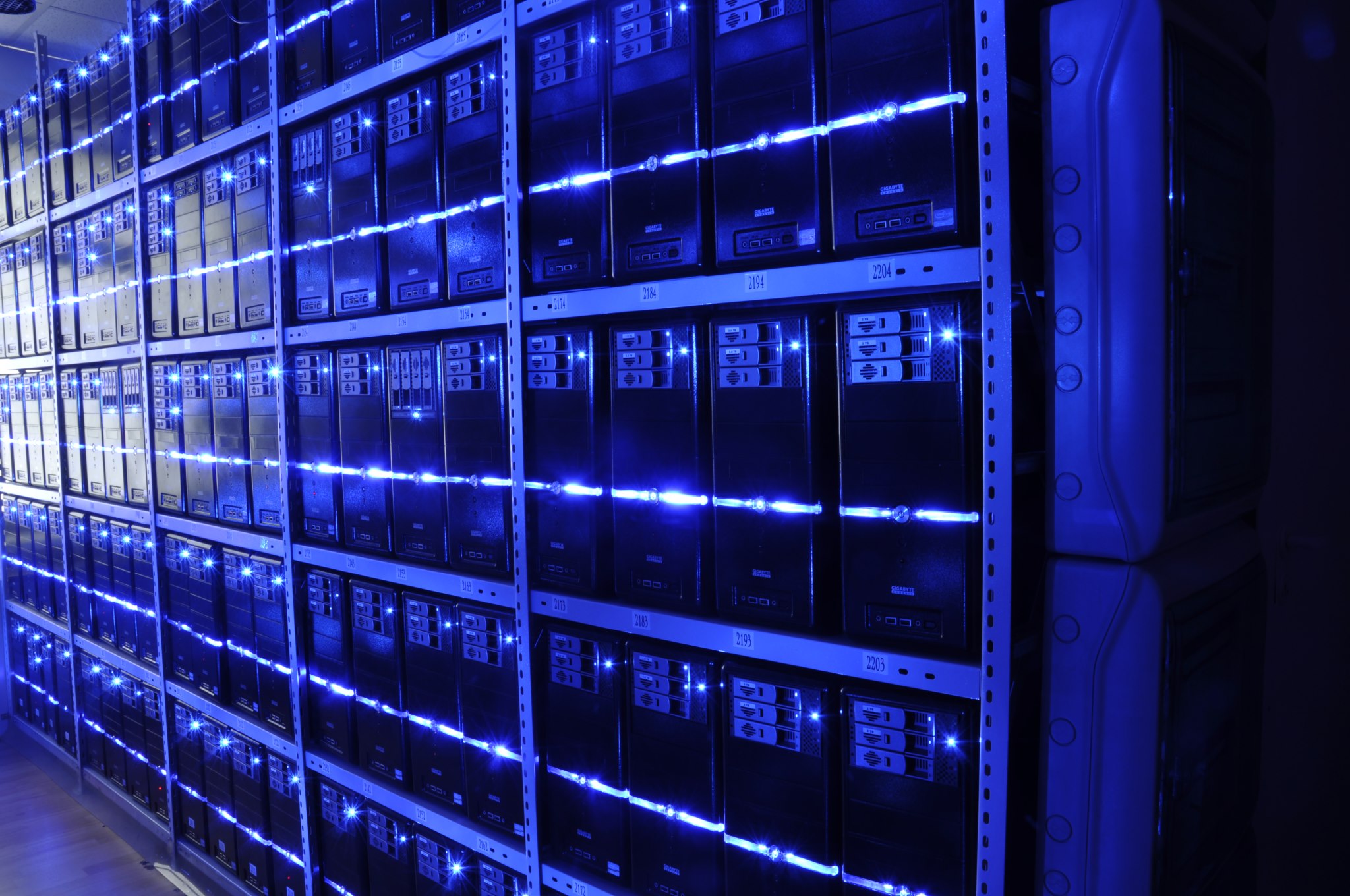 Inside a data center with rows of server racks