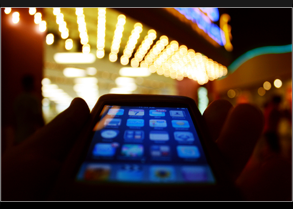 Person using smartphone for personal finance management