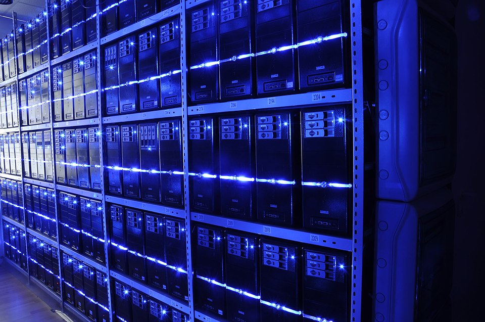 Inside a modern data center with rows of server racks