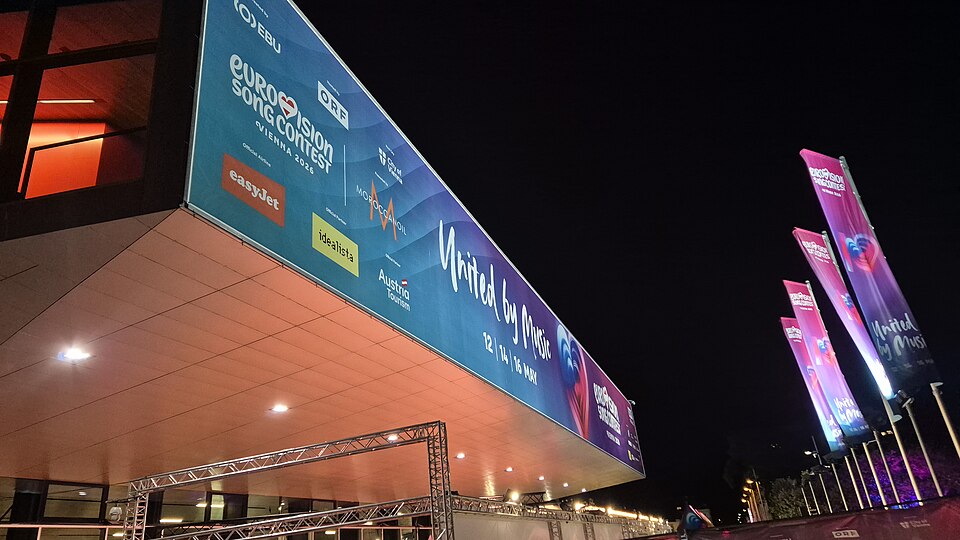 Wiener Stadthalle lit up at night for Eurovision 2026 in Vienna