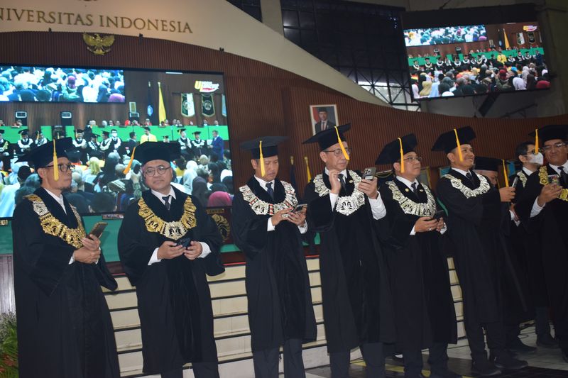 Graduates seated in rows during a university commencement ceremony
