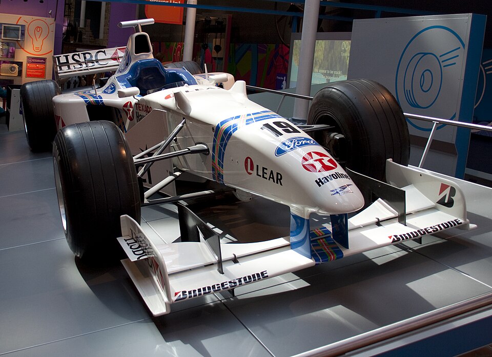 Classic Formula 1 racing car on display at motorsport exhibition
