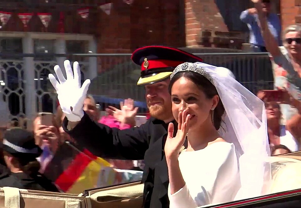 Prince Harry and Meghan Markle during their carriage procession through Windsor