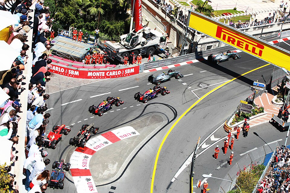 F1 car navigating the tight Monaco street circuit corners