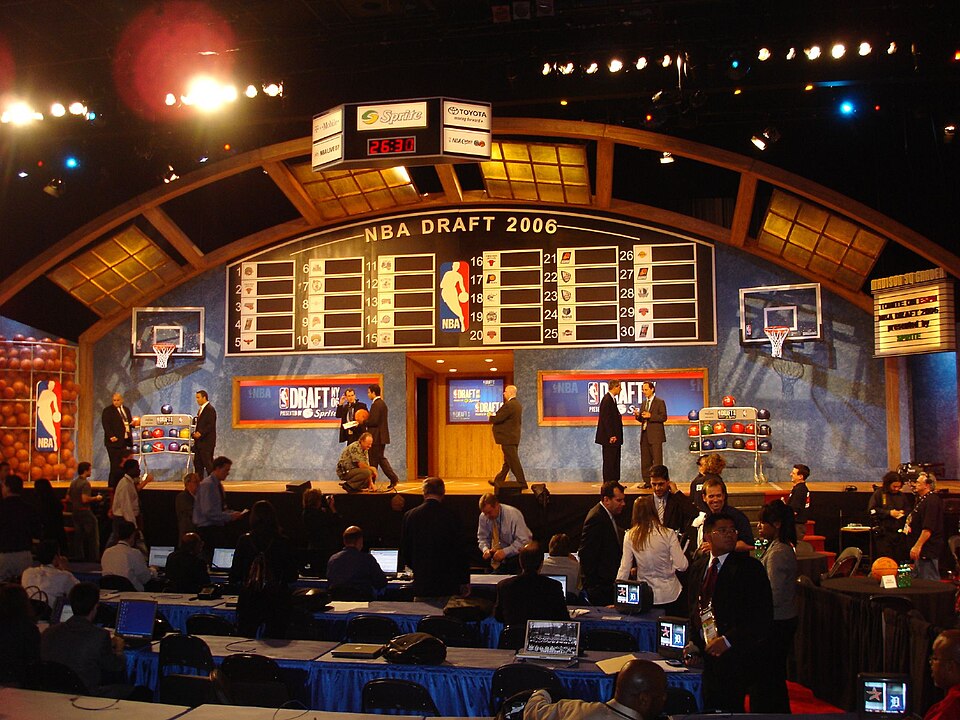NBA Draft stage with lottery board and team logos
