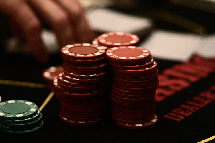 Pile of colorful gambling chips representing sports betting stakes