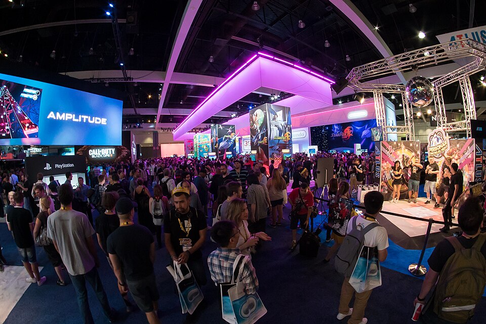 Gaming consoles and controllers displayed at a gaming convention, representing the broader gaming ecosystem