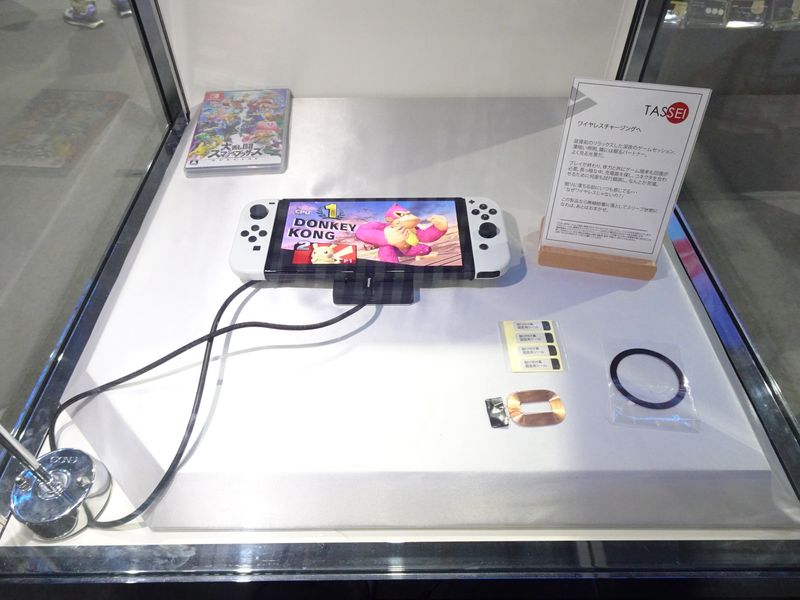 Tokyo Game Show exhibition floor with colorful gaming booths and large promotional displays
